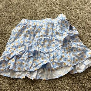 Blue girls skirt with daisys on it